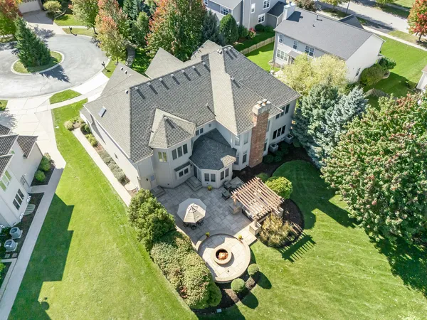 an aerial view of house with yard