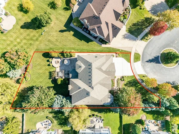 an aerial view of a house with a garden