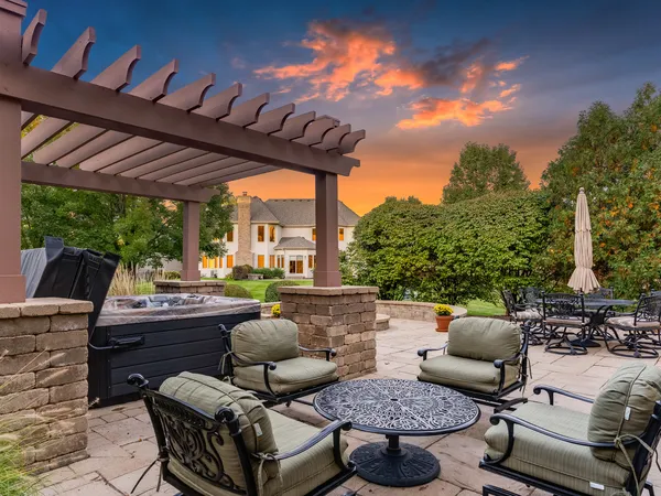 a outdoor space with patio fireplace and a potted plant