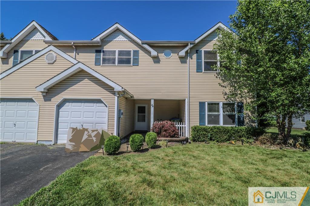 48 Woodbrook Road Edison, NJ 08820 - Photo 1 of 22 a front view of a house with garden