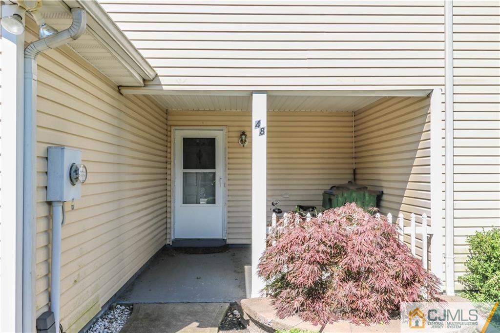 48 Woodbrook Road Edison, NJ 08820 - Photo 2 of 22 a view of a house with a door and wooden bench