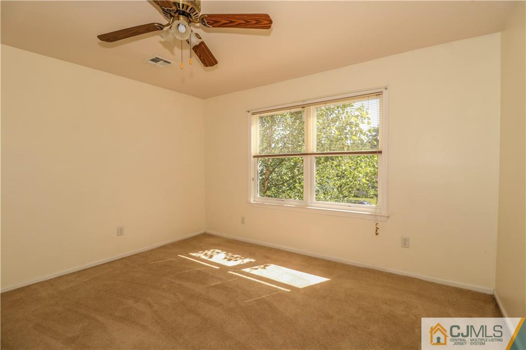 48 Woodbrook Road Edison, NJ 08820 - Photo 18 of 22 an empty room with a window