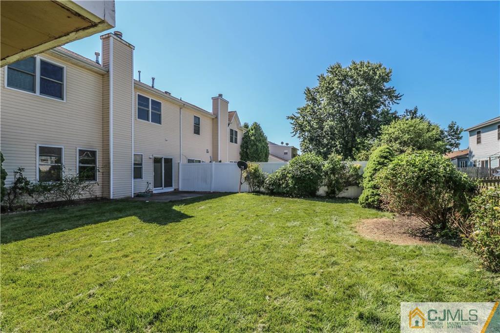 48 Woodbrook Road Edison, NJ 08820 - Photo 20 of 22 a view of a back yard of the house