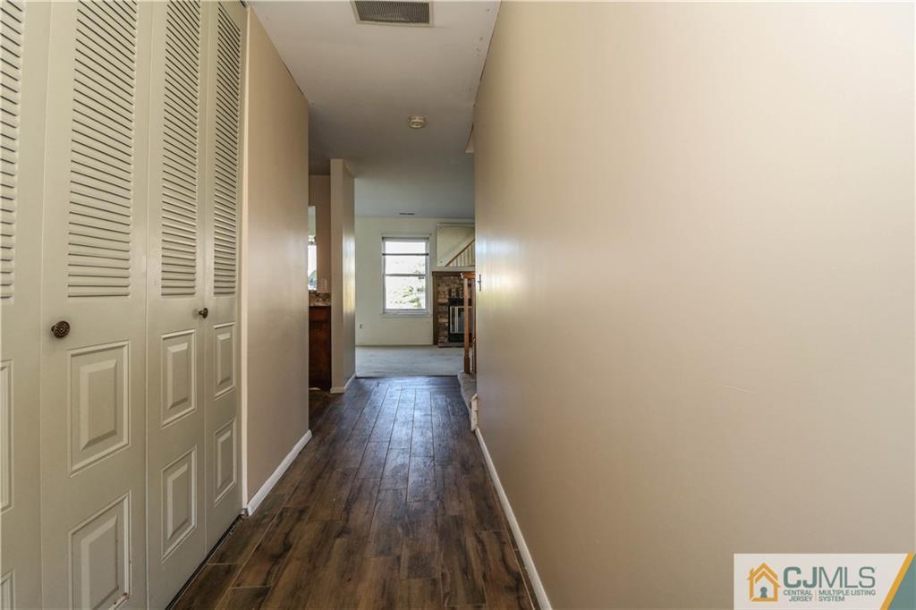48 Woodbrook Road Edison, NJ 08820 - Photo 3 of 22 a view of a hallway with wooden floor