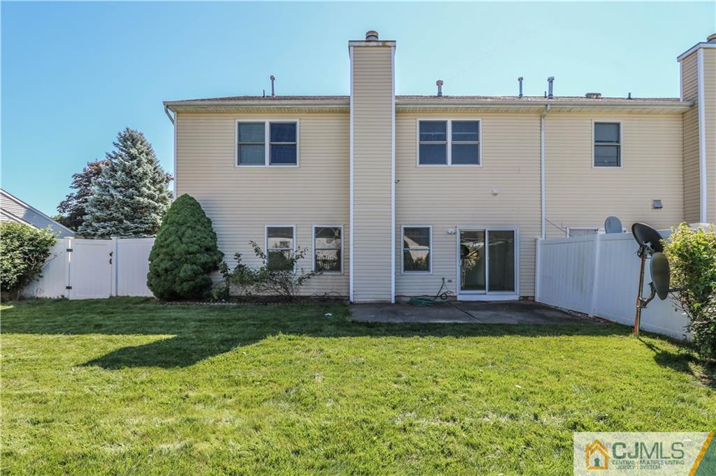 48 Woodbrook Road Edison, NJ 08820 - Photo 21 of 22 a front view of a house with a yard
