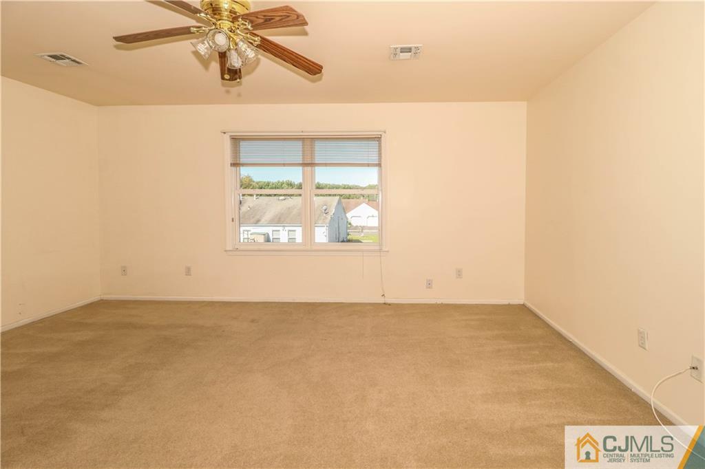 48 Woodbrook Road Edison, NJ 08820 - Photo 10 of 22 an empty room with a window