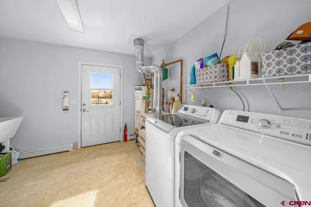 a view of storage and utility room with washer and dryer