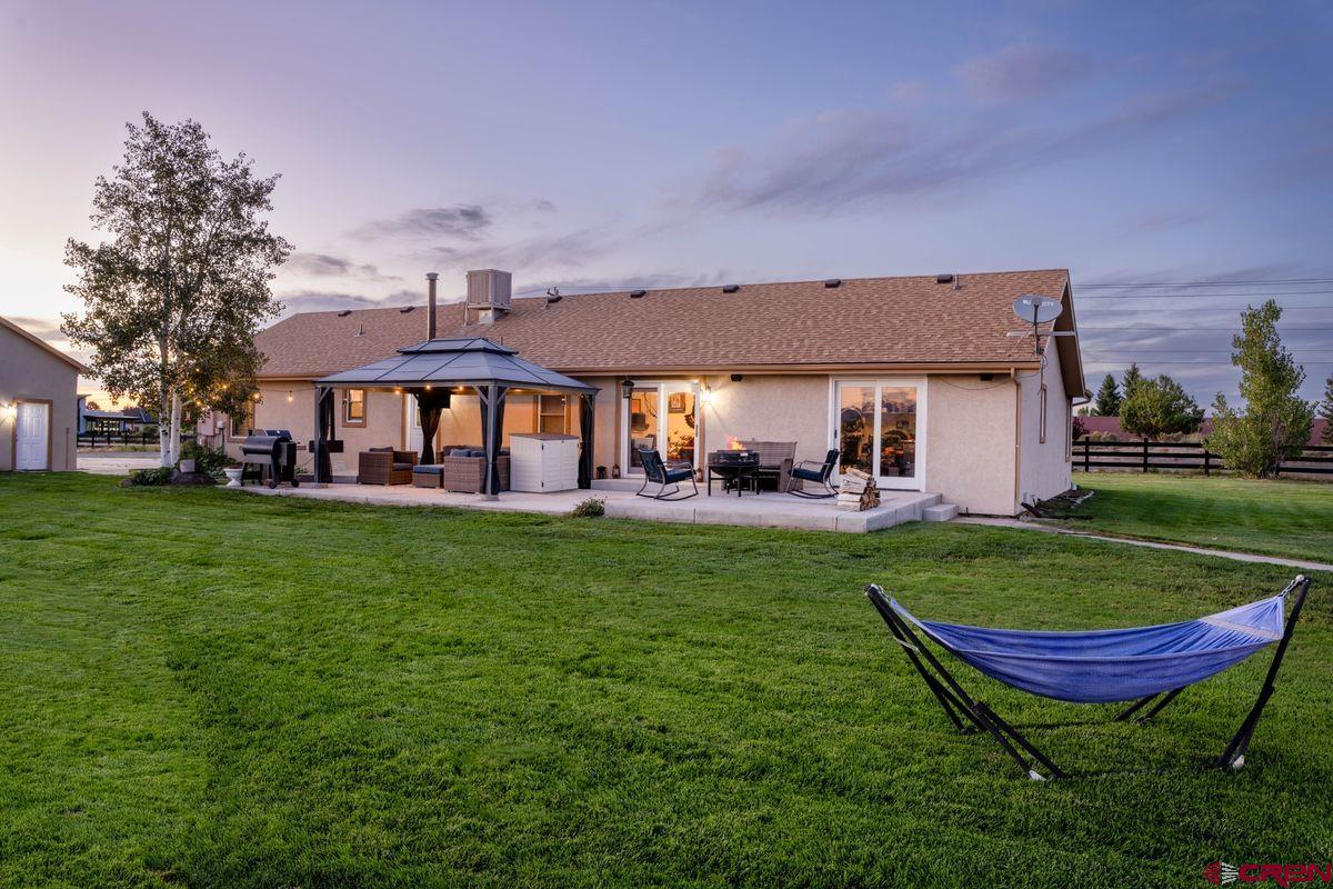 66460 Ogden Road Montrose, CO 81401 - Photo 23 of 40 a view of a swimming pool and a yard