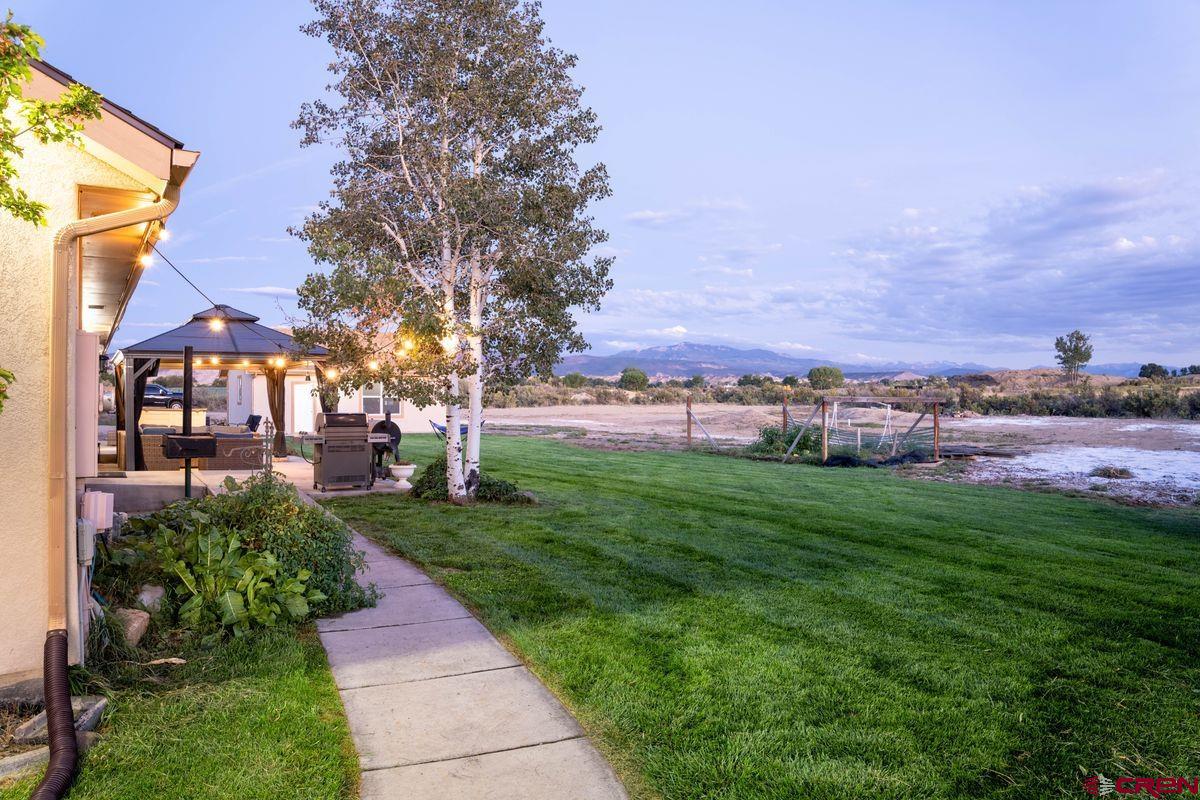 66460 Ogden Road Montrose, CO 81401 - Photo 24 of 40 a view of a garden with a building