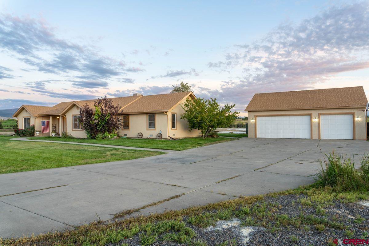 66460 Ogden Road Montrose, CO 81401 - Photo 25 of 40 a view of house with outdoor space and street view
