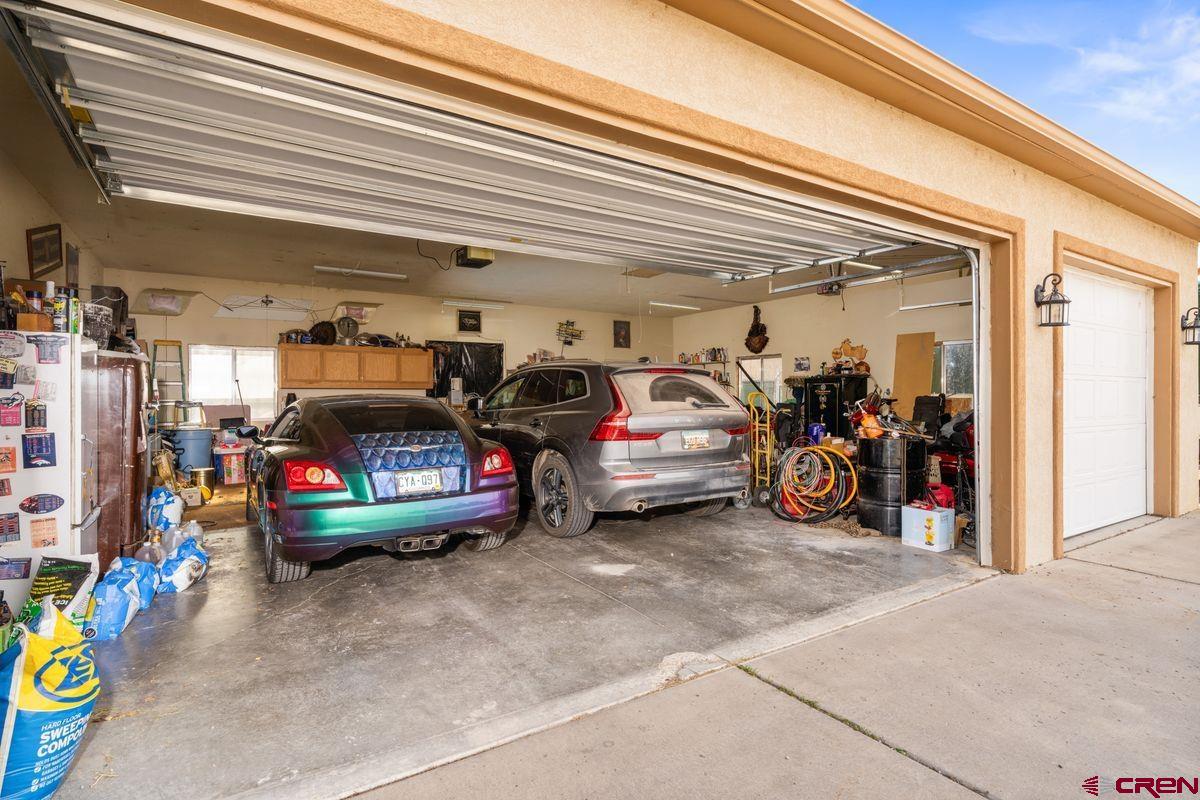66460 Ogden Road Montrose, CO 81401 - Photo 30 of 40 a view of a garage with parked cars