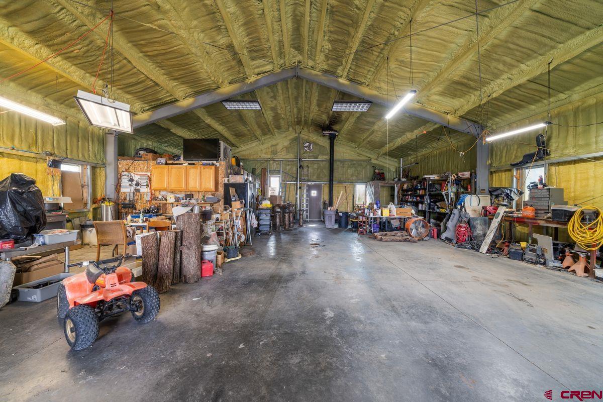 66460 Ogden Road Montrose, CO 81401 - Photo 37 of 40 a view of a storage room with racks on the wall