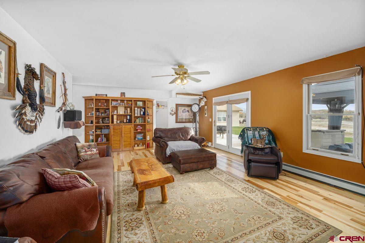 66460 Ogden Road Montrose, CO 81401 - Photo 9 of 40 a living room with furniture and a large window