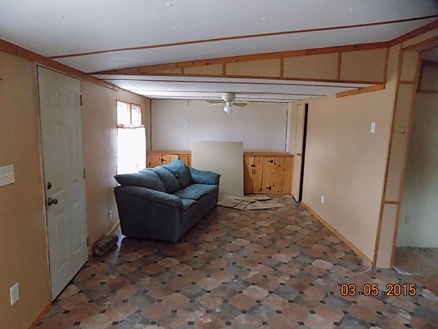 1356 Carl Sutton Road Lizella, GA 31052 - Photo 8 of 15 a living room with a couch and a window
