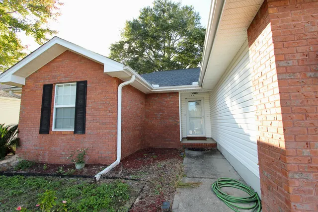 a backyard of a house with lots of green space
