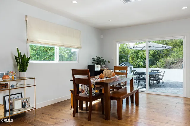 a view of a dining room with furniture window and outside view