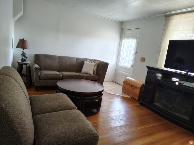 5264 West 5500th Street South Hooper, UT 84315 - Photo 14 of 20 Living area featuring wood-type flooring