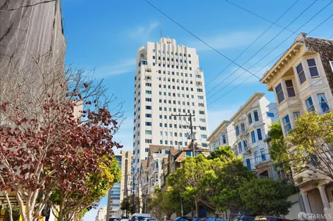 a view of a building with a city street