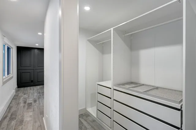a view of kitchen with refrigerator and window