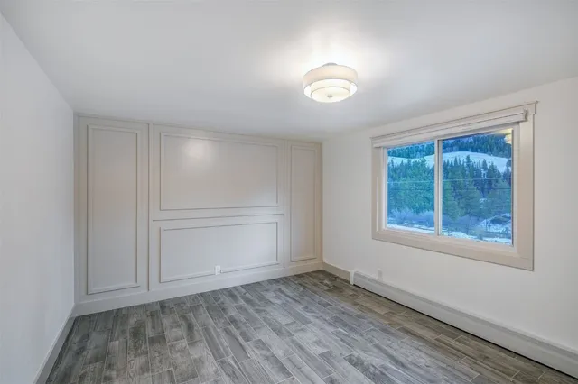 an empty room with a empty space and window