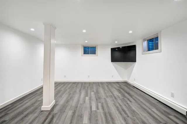 a view of a livingroom with wooden floor