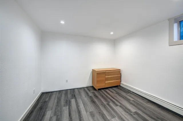 a view of room with wooden floor