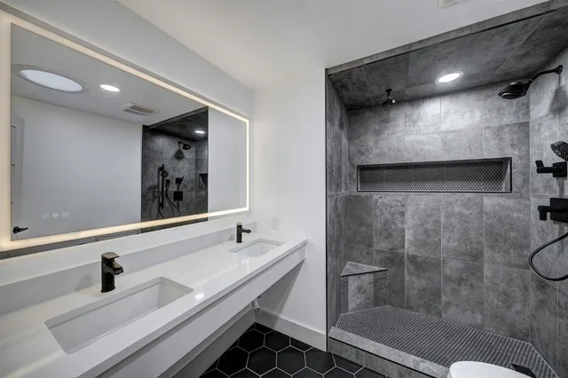 a bathroom with a sink and a mirror