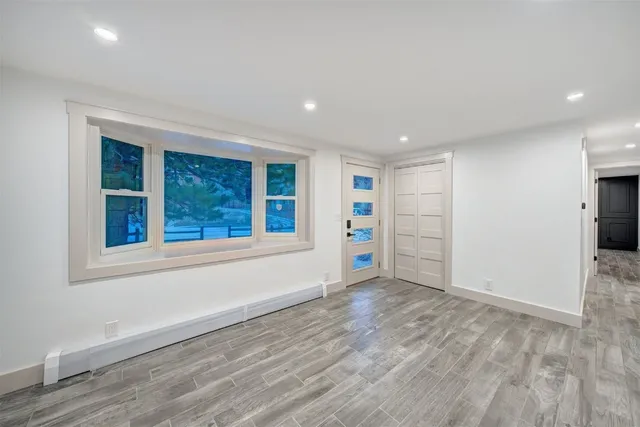 a view of an empty room with a window