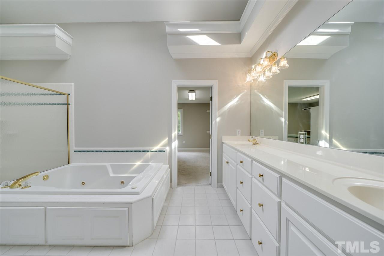 209 Claflin Court Raleigh, NC 27614 - Photo 15 of 30 Luxurious master bathroom will make you feel like you're at a spa.