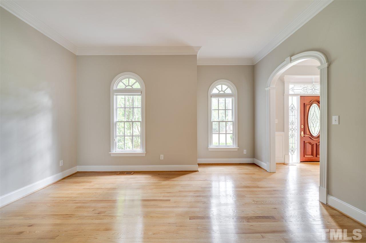 209 Claflin Court Raleigh, NC 27614 - Photo 3 of 30 The entire interior has been painted and this formal living room showcases the gorgeous gray tones found throughout.