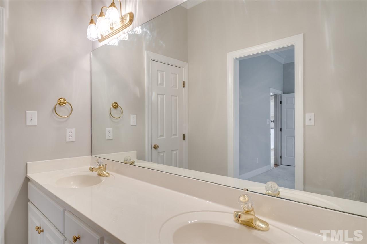 209 Claflin Court Raleigh, NC 27614 - Photo 22 of 30 2nd floor bathroom with dual vanities.