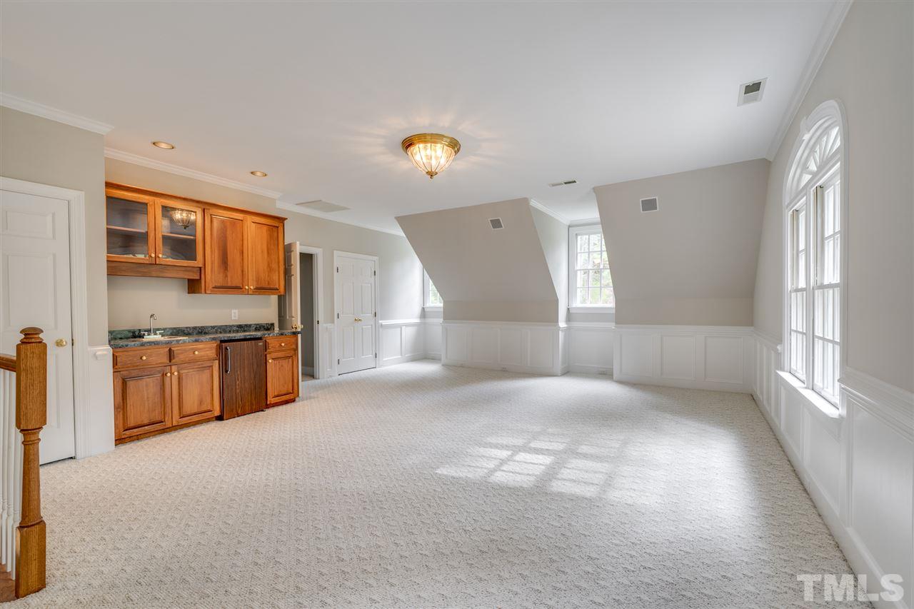 209 Claflin Court Raleigh, NC 27614 - Photo 23 of 30 Enjoy entertaining friends in this huge bonus room that has a great wet bar. This room has great storage!