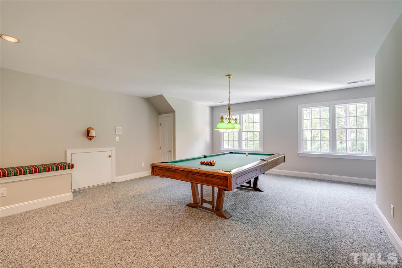209 Claflin Court Raleigh, NC 27614 - Photo 24 of 30 Enjoy playing some pool on the private 3rd floor. This huge bonus room has great storage and a full bathroom!!!