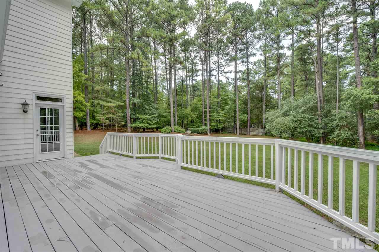 209 Claflin Court Raleigh, NC 27614 - Photo 25 of 30 All your friends and family will look forward to your summer cookouts on this huge deck overlooking this park like setting.