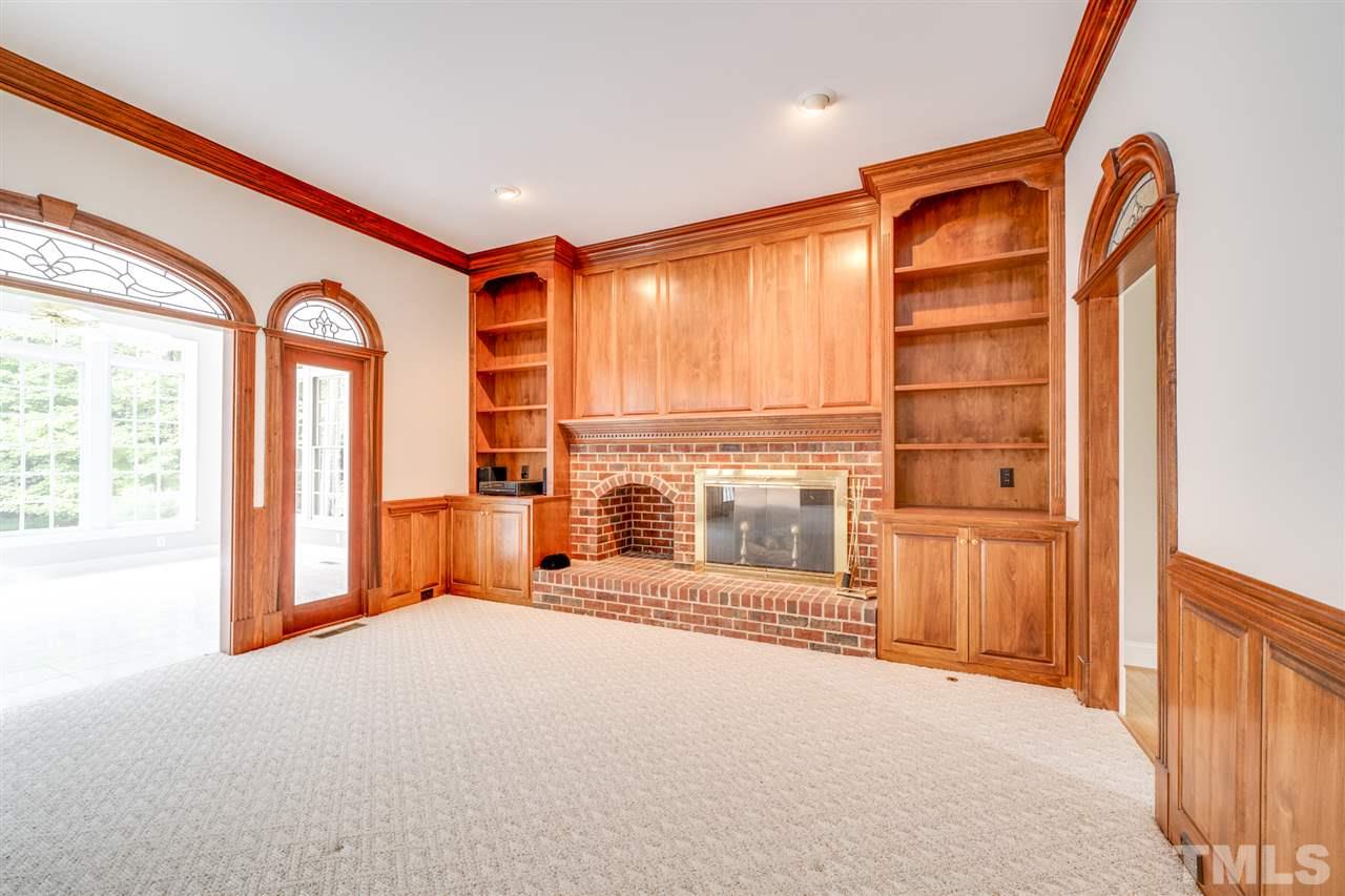 209 Claflin Court Raleigh, NC 27614 - Photo 5 of 30 On a cold winter's day, you can snuggle up in front of this beautiful fireplace with a good book or watch your favorite movie.