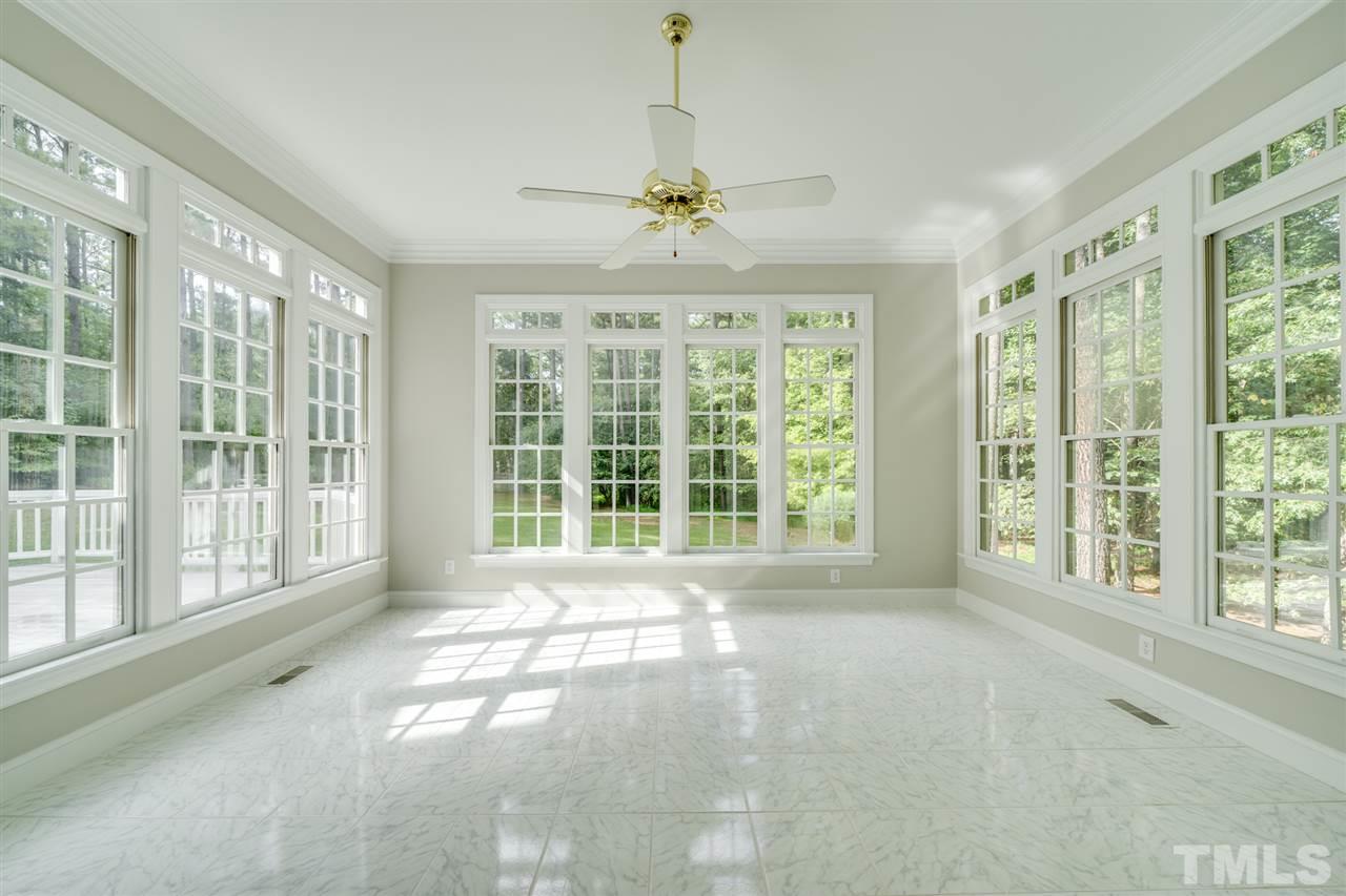 209 Claflin Court Raleigh, NC 27614 - Photo 6 of 30 Enjoy the outside from the inside. Lots of windows to bring in the beauty of your private backyard.