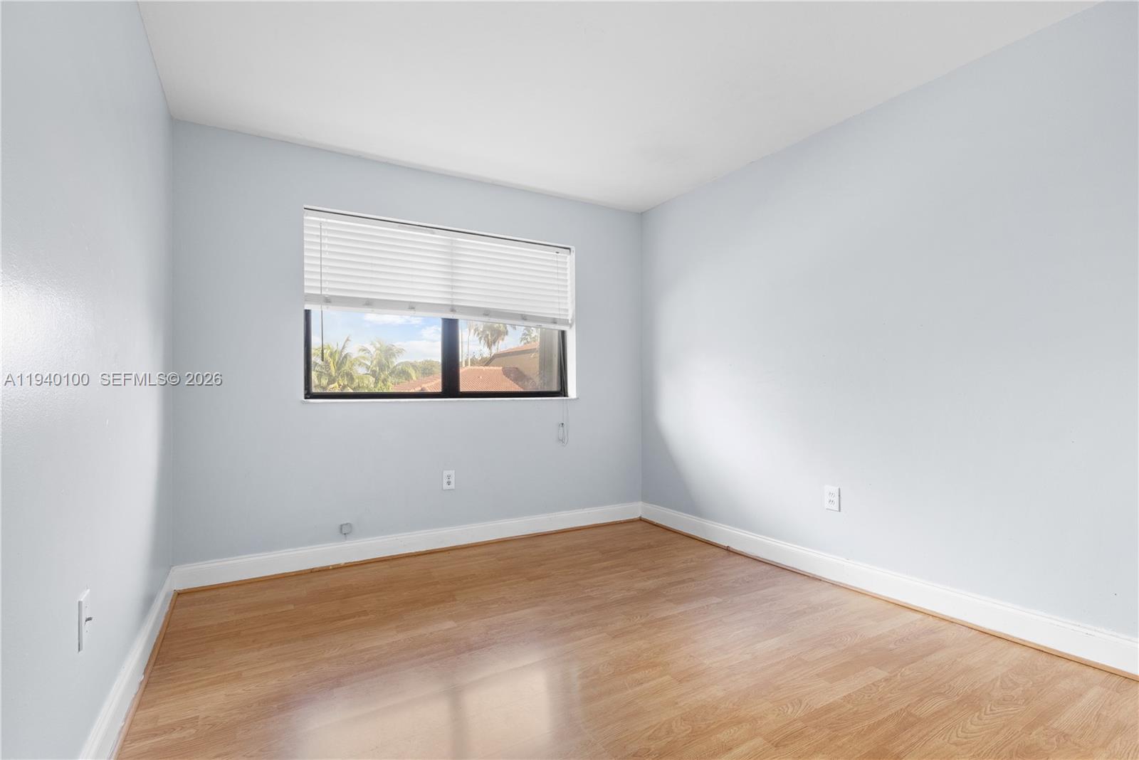 15520 Southwest 80th Street, Unit B301 Miami, FL 33193 - Photo 18 of 26 an empty room with a window