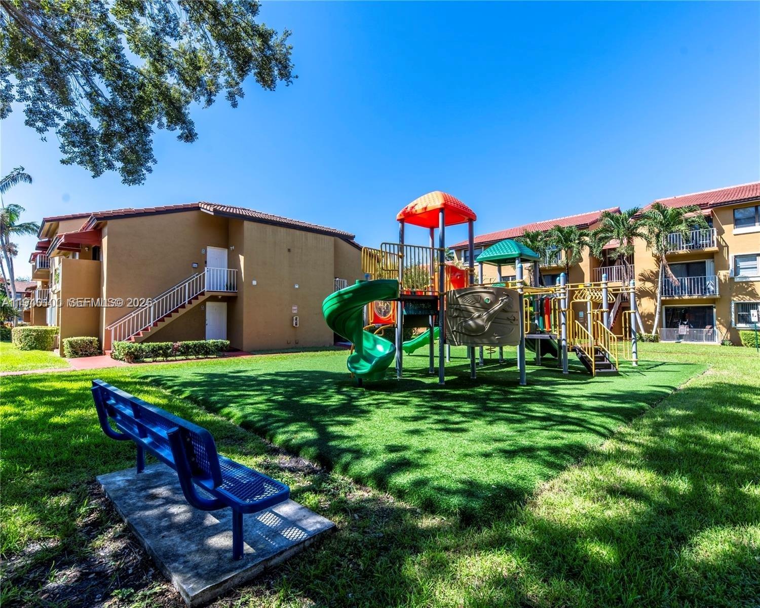 15520 Southwest 80th Street, Unit B301 Miami, FL 33193 - Photo 23 of 26 a view of a house with a backyard