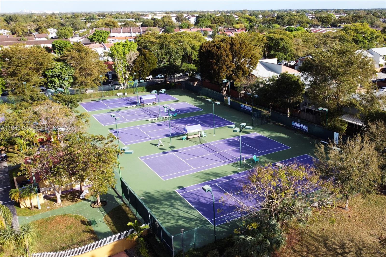 15520 Southwest 80th Street, Unit B301 Miami, FL 33193 - Photo 24 of 26 an aerial view of residential houses with outdoor space