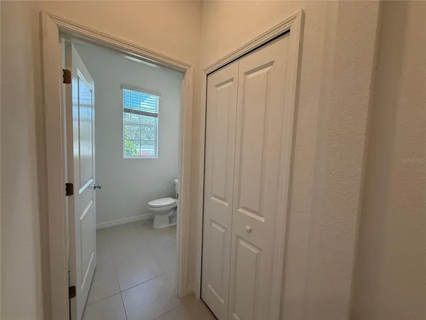 a view of an empty room with a cabinet