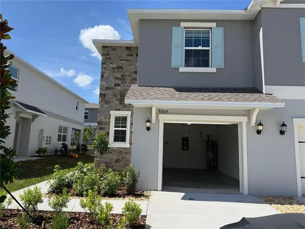 a view of a pathway both side of the house