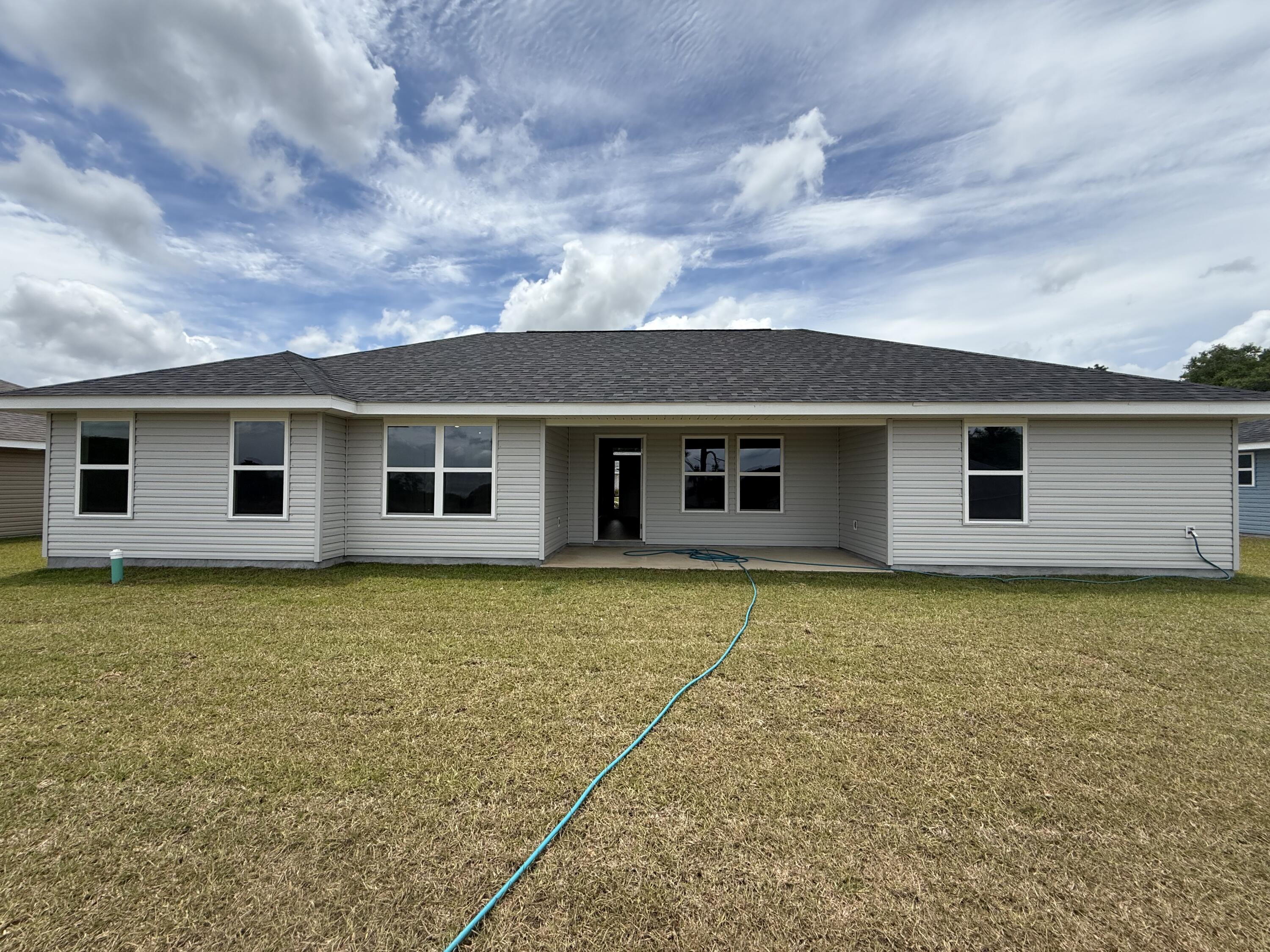 6002 Crocket Cove Crestview, FL 32539 - Photo 28 of 29 a view of a house with a backyard