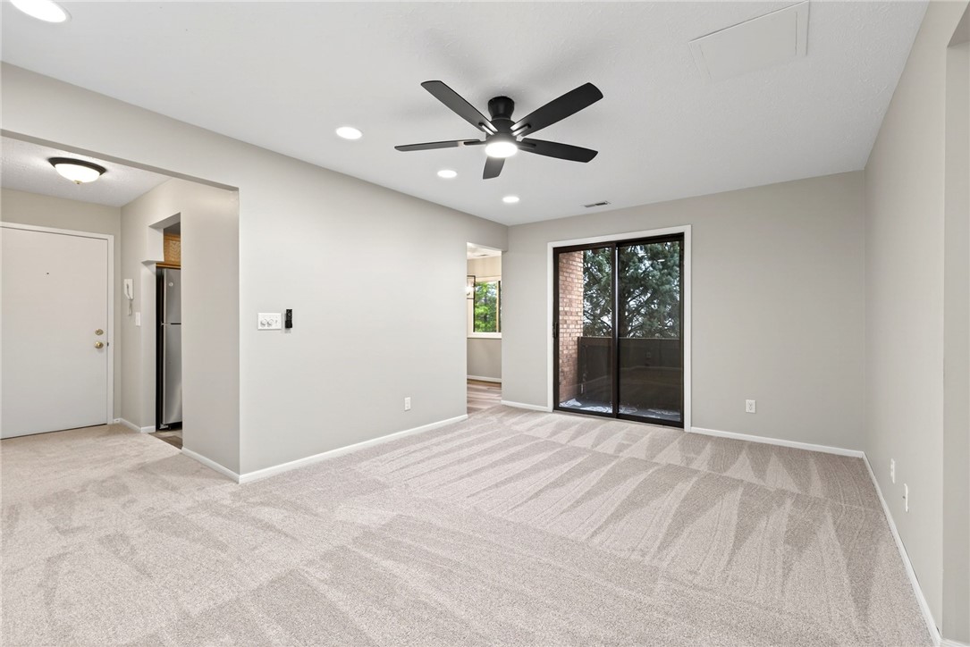 3151 Roesch Boulevard, Unit 6 Fairfield, OH 45014 - Photo 14 of 29 Bright and inviting living area with plush carpeting, offering comfortable and adaptable living space.