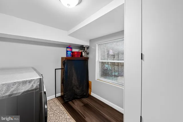 a bed room with a bed and a window