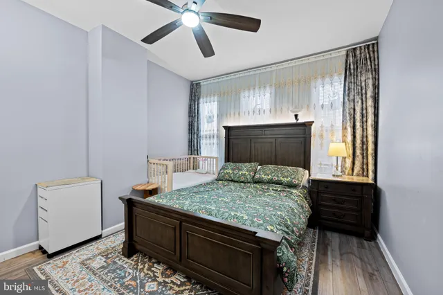 a bedroom with bed and window