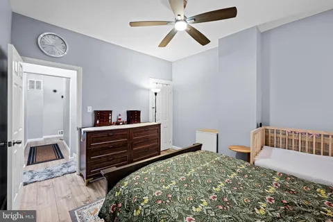 a bedroom with a bed and a dresser