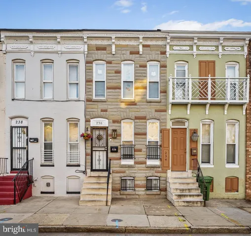 a front view of a building with windows