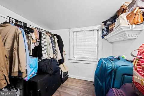 a bathroom with a sink mirror and toilet