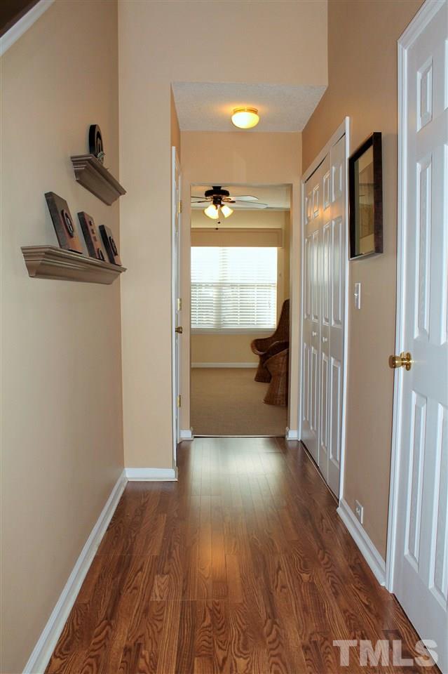 5022 Gable Ridge Drive Durham, NC 27713 - Photo 2 of 24 a view of a hallway with wooden floor and closet