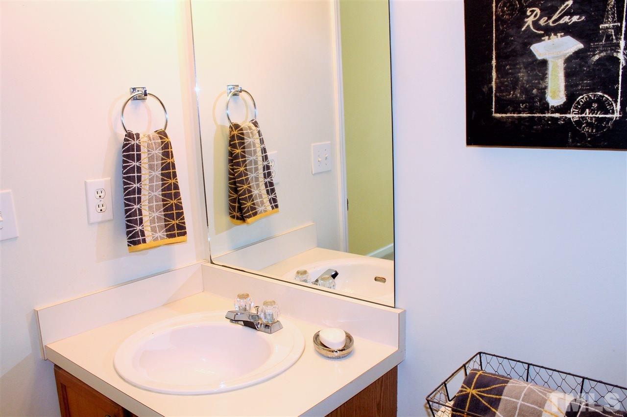 5022 Gable Ridge Drive Durham, NC 27713 - Photo 15 of 24 a bathroom with a sink and a mirror